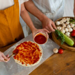 Andrea Vella shows with his wife how authentic Italian pizza succeeds at home